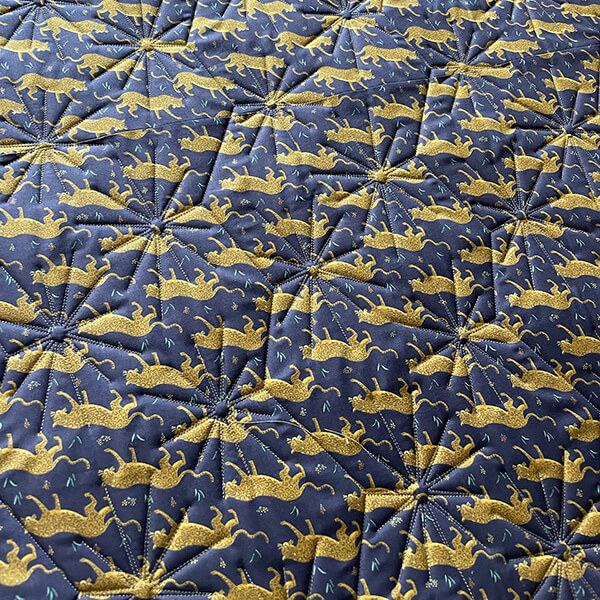 Close-up of a machine quilted pattern